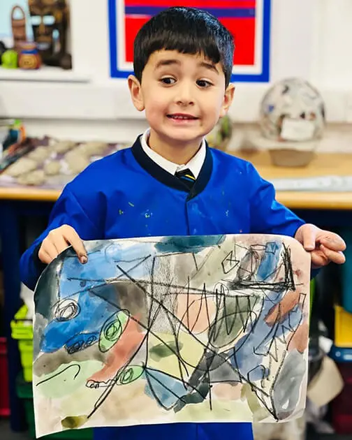 A pupil at The Ryleys School, a private school in Cheshire, showing their Kandinsky-inspired artwork