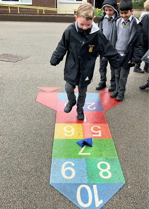 Year 1 pupils at The Ryleys School, a private school in Cheshire, playing the French game La Marella in the playground