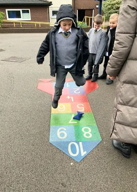 Year 1 pupils at The Ryleys School, a private school in Cheshire, playing the French game La Marella in the playground