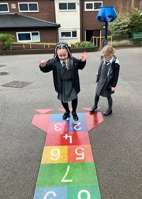 Year 1 pupils at The Ryleys School, a private school in Cheshire, playing the French game La Marella in the playground