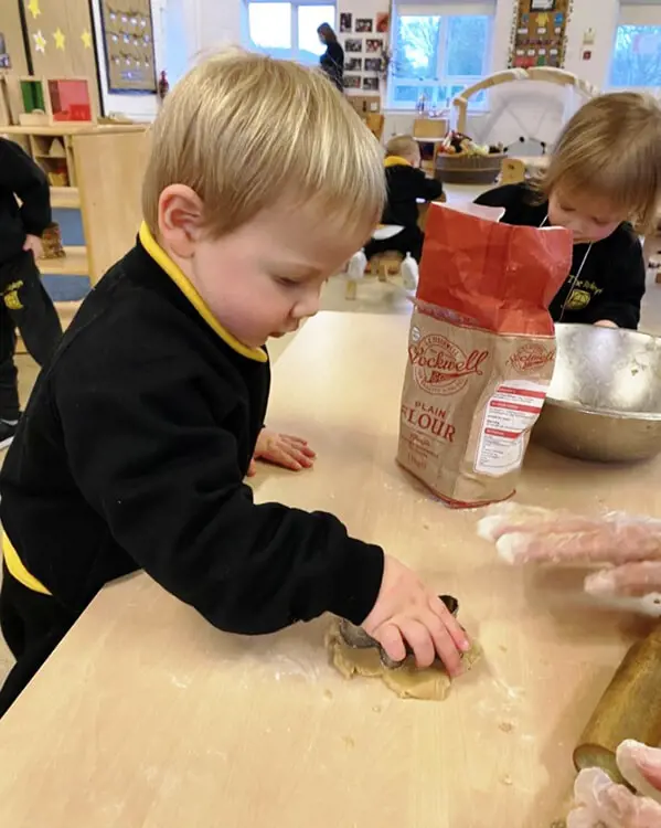 Pupils at Nursery at The Ryleys School, a private school in Cheshire, baking gingerbread men