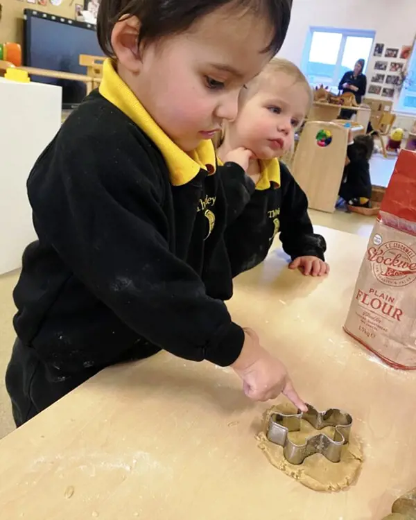 Pupils at Nursery at The Ryleys School, a private school in Cheshire, baking gingerbread men