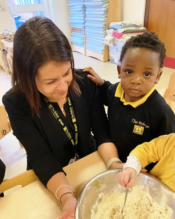 Pupils at Nursery at The Ryleys School, a private school in Cheshire, baking gingerbread men