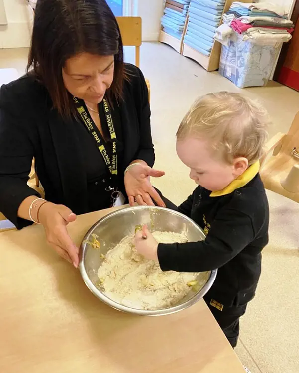 Pupils at Nursery at The Ryleys School, a private school in Cheshire, baking gingerbread men