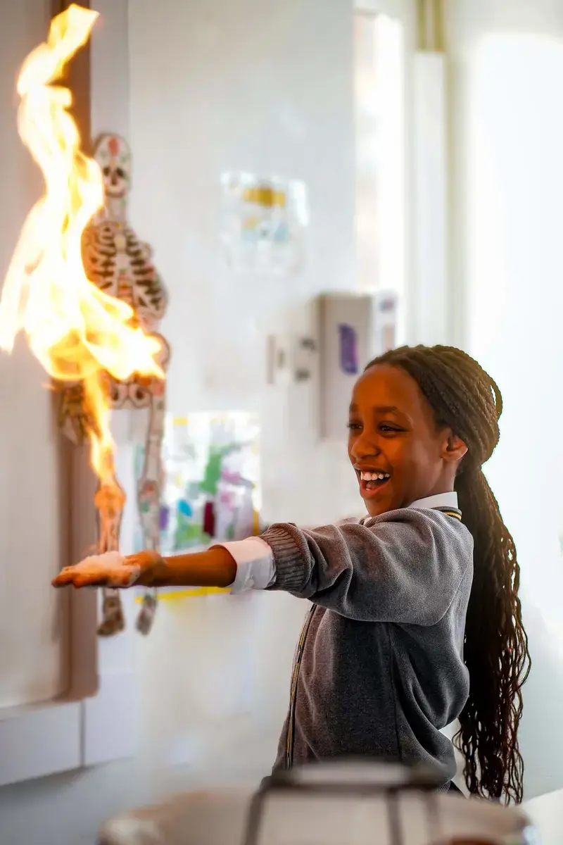 Pupil in science class conducting an experiment at The Ryleys School, a prep school in Cheshire