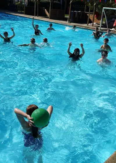 Pupils enjoying water polo in the swimming pool at The Ryleys School, a private school in Cheshire