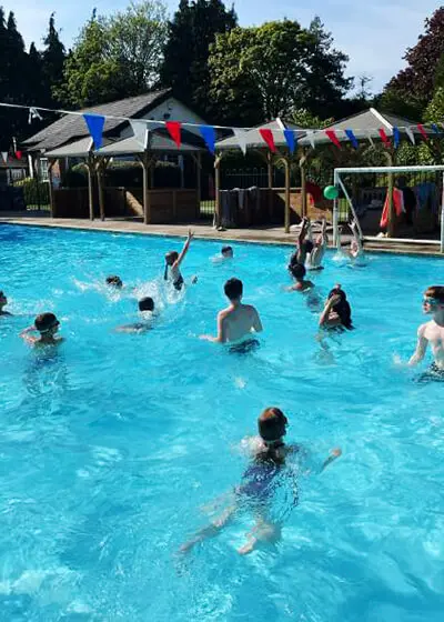 Pupils enjoying water polo in the swimming pool at The Ryleys School, a private school in Cheshire