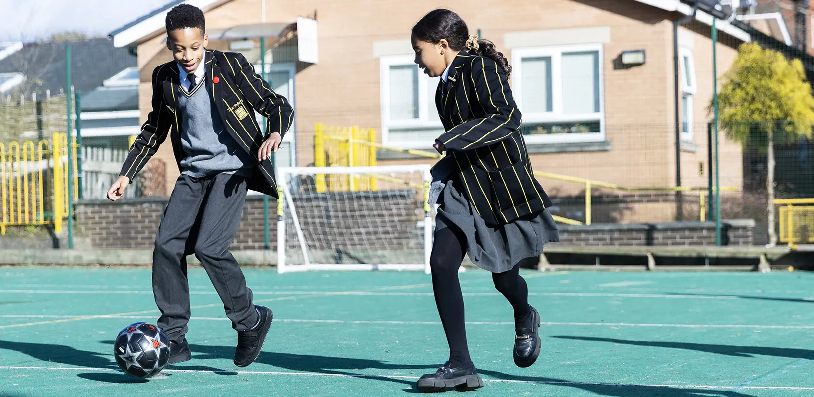 Prep School pupils playing football at The Ryleys School, a private school in Cheshire