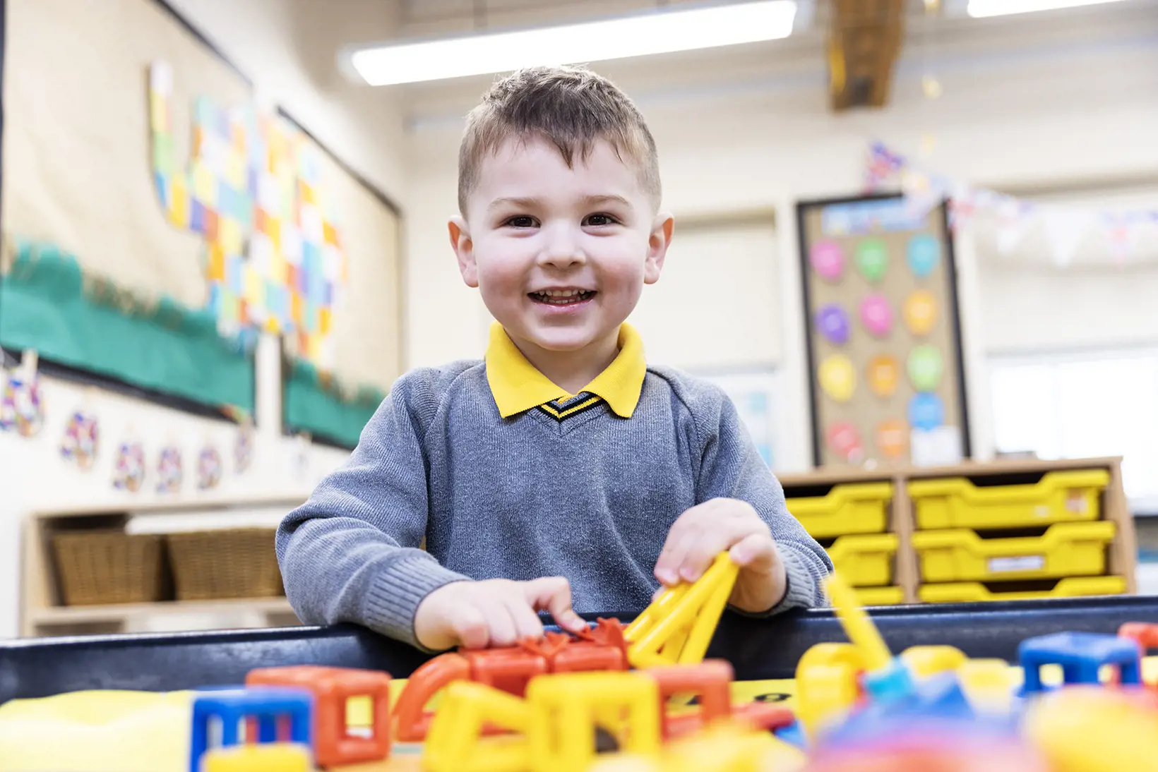 Early Years pupil playing with educational toys at The Ryleys School, an independent school in Cheshire